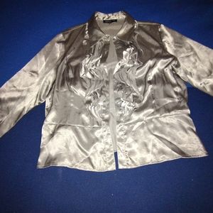 A polyester blend satin glossy blouse